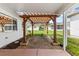 Relaxing patio with pergola and brick pavers, perfect for outdoor entertaining at 1618 Birchwood Loop, Lakeland, FL 33811
