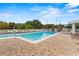 Large community pool with surrounding deck at 1618 Birchwood Loop, Lakeland, FL 33811