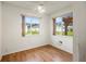 Bright bedroom with ceiling fan, neutral carpeting, and large windows at 1618 Birchwood Loop, Lakeland, FL 33811