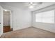 Bedroom with ceiling fan and carpet flooring at 1618 Birchwood Loop, Lakeland, FL 33811