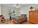 Cozy bedroom with wood flooring and a large dresser at 511 Alcazar Ct, The Villages, FL 32159