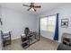 Home office with a desk, chair, and ample natural light at 1781 Ashworth Loop, Lakeland, FL 33810