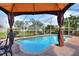 Relaxing poolside seating under the covered gazebo at 6562 Evergreen Park Dr, Lakeland, FL 33813