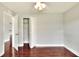 Well-lit bedroom with hardwood floors and closet at 6562 Evergreen Park Dr, Lakeland, FL 33813