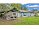 Spacious backyard with patio, grill, and covered seating area at 1705 Davis Ave, Bartow, FL 33830
