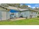 Small backyard patio with a blue shade canopy at 1705 Davis Ave, Bartow, FL 33830