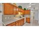 Kitchen with wood cabinets and tile backsplash at 6202 Peacock Run, Lakeland, FL 33809