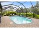 Inviting screened pool and spa with brick pavers at 4020 Prima Lago Cir, Lakeland, FL 33810