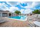 Inviting community pool with lounge chairs and a brick patio at 4829 Colonnades E Cir, Lakeland, FL 33811