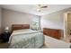 Cozy bedroom with a queen-size bed and ample dresser storage at 4829 Colonnades E Cir, Lakeland, FL 33811