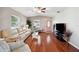 Spacious living room featuring hardwood floors and neutral color palette at 4829 Colonnades E Cir, Lakeland, FL 33811
