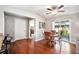 Bright dining room with wood table and chairs and access to patio at 4829 Colonnades E Cir, Lakeland, FL 33811