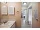 Simple bathroom with a sink and hallway access at 4829 Colonnades E Cir, Lakeland, FL 33811