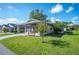Single-story home with a nicely landscaped yard at 4829 Colonnades E Cir, Lakeland, FL 33811