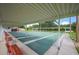 Community shuffleboard courts with covered seating areas at 4829 Colonnades E Cir, Lakeland, FL 33811