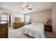 Spacious bedroom with a queen bed and ensuite access at 4829 Colonnades E Cir, Lakeland, FL 33811