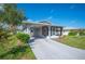 Single story home with carport and porch at 4829 Colonnades E Cir, Lakeland, FL 33811