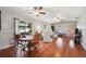 Open living space with hardwood floors, neutral decor and pink door at 4829 Colonnades E Cir, Lakeland, FL 33811