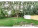 Backyard with large tree, shed and wooden fence at 2429 Lakeview St, Lakeland, FL 33801