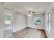 Bright living room with hardwood floors and ceiling fan at 2429 Lakeview St, Lakeland, FL 33801