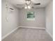 Bright bedroom with neutral walls and carpet flooring at 2429 Lakeview St, Lakeland, FL 33801
