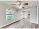 Bright bedroom with ceiling fan and hardwood flooring at 2429 Lakeview St, Lakeland, FL 33801