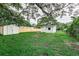 Large backyard with storage shed and wooden fence at 2429 Lakeview St, Lakeland, FL 33801