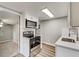 Updated kitchen with white cabinets and stainless steel appliances at 2429 Lakeview St, Lakeland, FL 33801