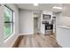 Modern kitchen with white cabinets, stainless steel appliances, and vinyl flooring at 2429 Lakeview St, Lakeland, FL 33801