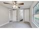 Spacious bedroom with ceiling fan and access to the bathroom at 2429 Lakeview St, Lakeland, FL 33801