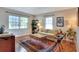 Living room with hardwood floors, area rug, and comfy seating at 1819 Meadowbrook Ave, Lakeland, FL 33803