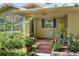 Front porch of a house with terracotta tile and potted plants at 1819 Meadowbrook Ave, Lakeland, FL 33803