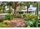 Landscaped front yard with a bench and various plants at 1819 Meadowbrook Ave, Lakeland, FL 33803