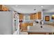Kitchen features wood cabinets, appliances, and breakfast bar at 4390 Sunnyside Dr, Lakeland, FL 33810