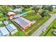 Aerial view showing home, pool, detached garage and large backyard at 4390 Sunnyside Dr, Lakeland, FL 33810