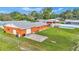 Aerial view of house, detached garage, large backyard, and pool at 4390 Sunnyside Dr, Lakeland, FL 33810