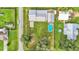Aerial view showing home, pool, detached garage and large backyard at 4390 Sunnyside Dr, Lakeland, FL 33810