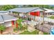 Covered patio area with seating, golf cart, and detached garage at 4390 Sunnyside Dr, Lakeland, FL 33810