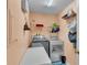 Laundry room with washer, dryer, and shelving at 4390 Sunnyside Dr, Lakeland, FL 33810