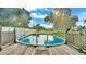 Inviting above ground pool with wooden deck at 4390 Sunnyside Dr, Lakeland, FL 33810