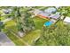 Aerial view showing home, pool, detached garage and large backyard at 4390 Sunnyside Dr, Lakeland, FL 33810