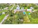 Aerial view showing home, pool, detached garage and large backyard at 4390 Sunnyside Dr, Lakeland, FL 33810