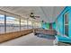 Relaxing screened porch with tropical mural at 4390 Sunnyside Dr, Lakeland, FL 33810