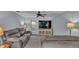 Bright living room with comfortable seating and TV at 4390 Sunnyside Dr, Lakeland, FL 33810