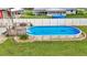Above ground pool with deck and landscaping at 4390 Sunnyside Dr, Lakeland, FL 33810