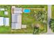 Aerial view showing home, pool, detached garage and large backyard at 4390 Sunnyside Dr, Lakeland, FL 33810