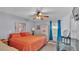 Main bedroom with ceiling fan and large bed at 4390 Sunnyside Dr, Lakeland, FL 33810