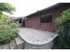 Brick patio with retaining wall and access to a sunroom at 4428 Sugartree E Dr, Lakeland, FL 33813