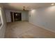 Spacious living room with carpeting and sliding glass doors at 4428 Sugartree E Dr, Lakeland, FL 33813