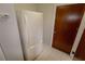 Foyer with refrigerator and door to another room at 4428 Sugartree E Dr, Lakeland, FL 33813